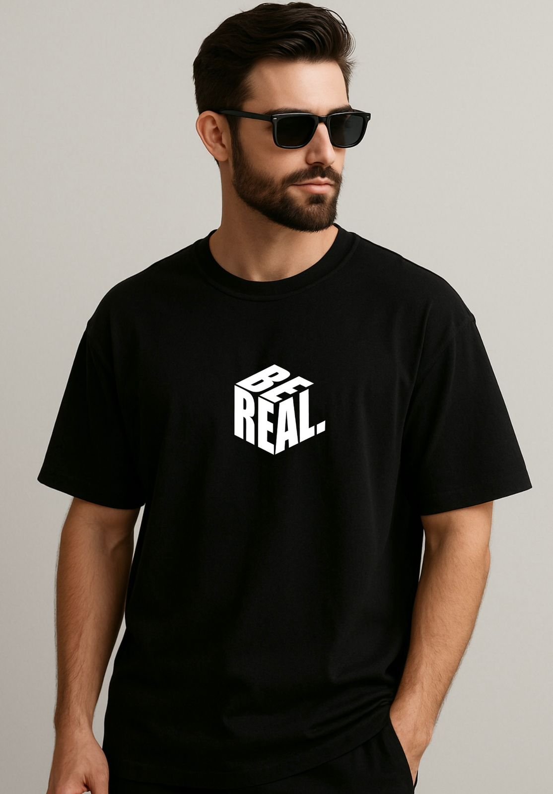 oversize tshirt with graphic features the word "BE REAL"